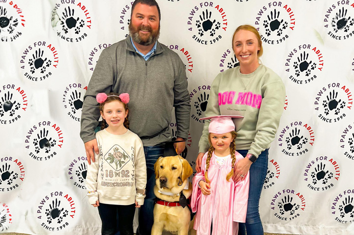 The Bright Side: Koozie Group-Sponsored Service Dog Placed With Young Girl
