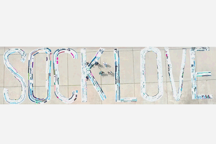 The Bright Side: Sock Club Breaks World Record for Largest Words Spelled by Socks