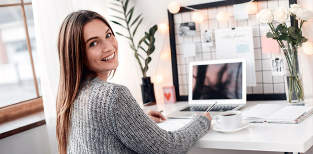 Woman sitting at desk in home office
