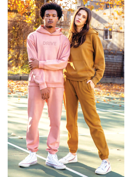 young man and woman wearing earth-colored sweat suits