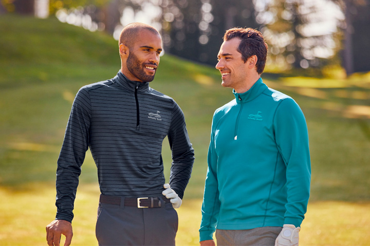 golfers on course, smiling