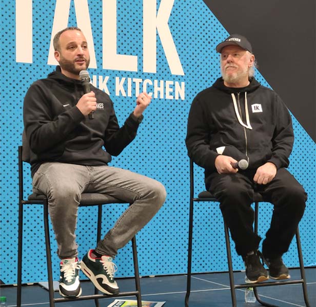 two men on stage talking