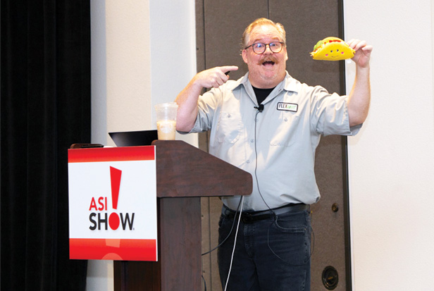 Jay Busselle holding a stuffed toy taco