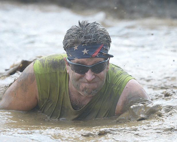 Joe Farve crawling through murky water