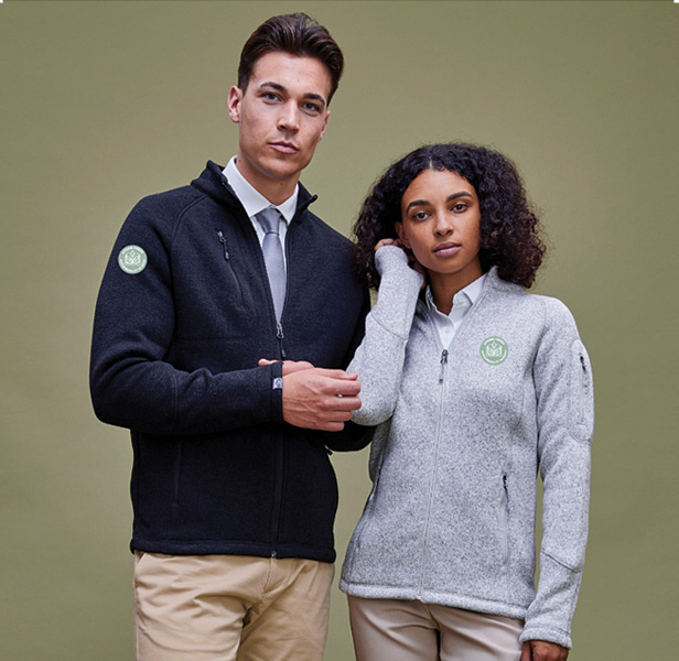 man and woman modeling fleece jackets